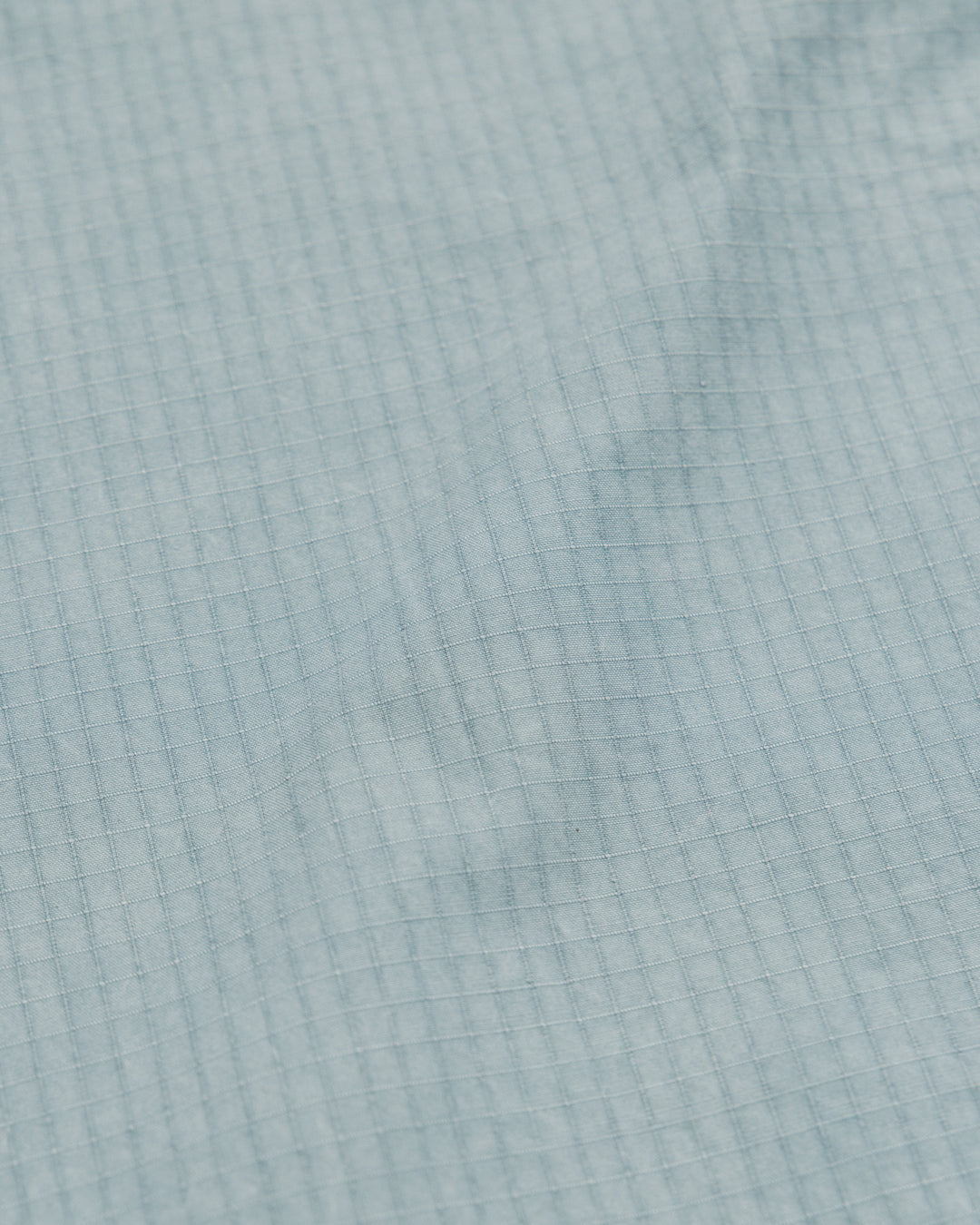Garment Dyed Atlas Pants - Powder Blue — ripstop fabric texture close-up