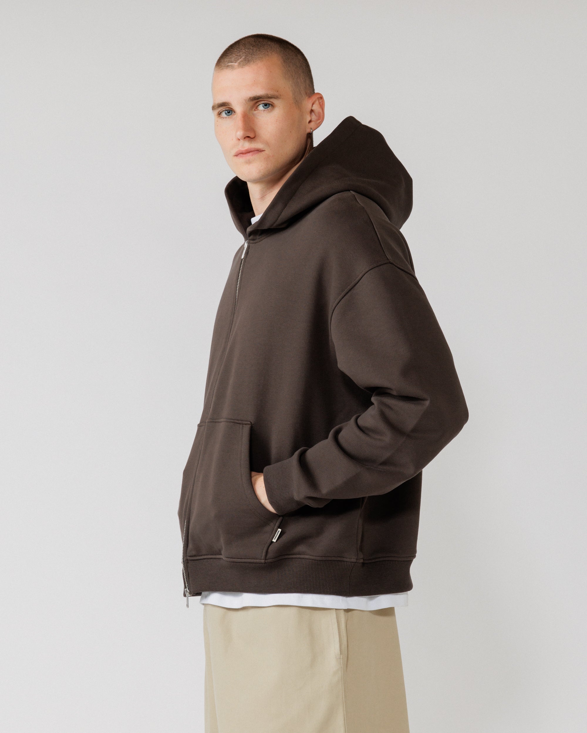 Heavyweight Two-Way Zip Hoody - Chocolate Brown — Male side angle, pocket in use