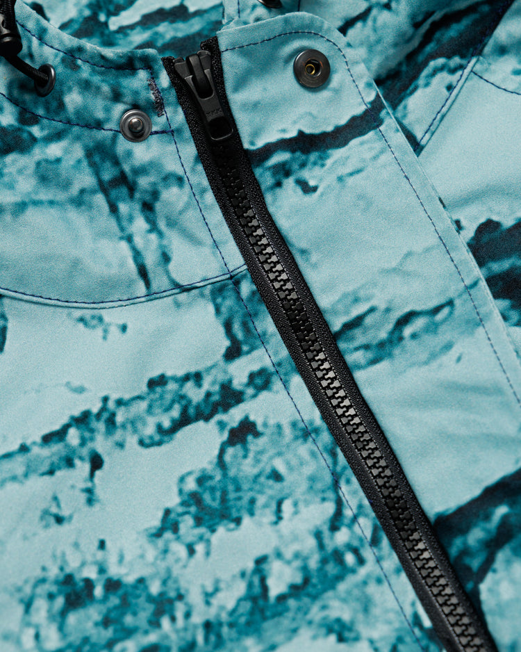 Roam Raglan Jacket - Blue Brick Camo — zip and snap hardware detail