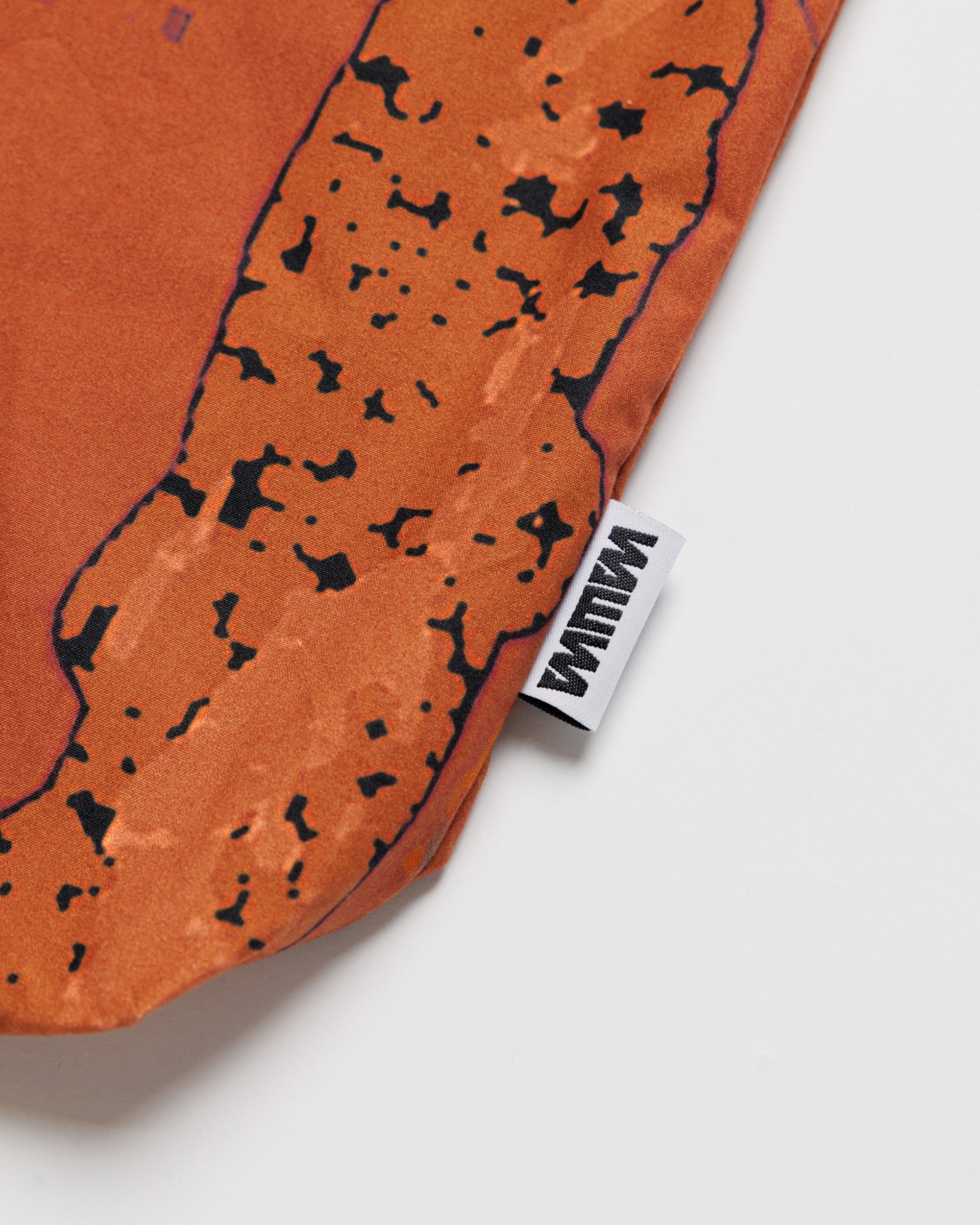Water Resistant Messenger Bag - Abstract Brick Camo — print and label close-up